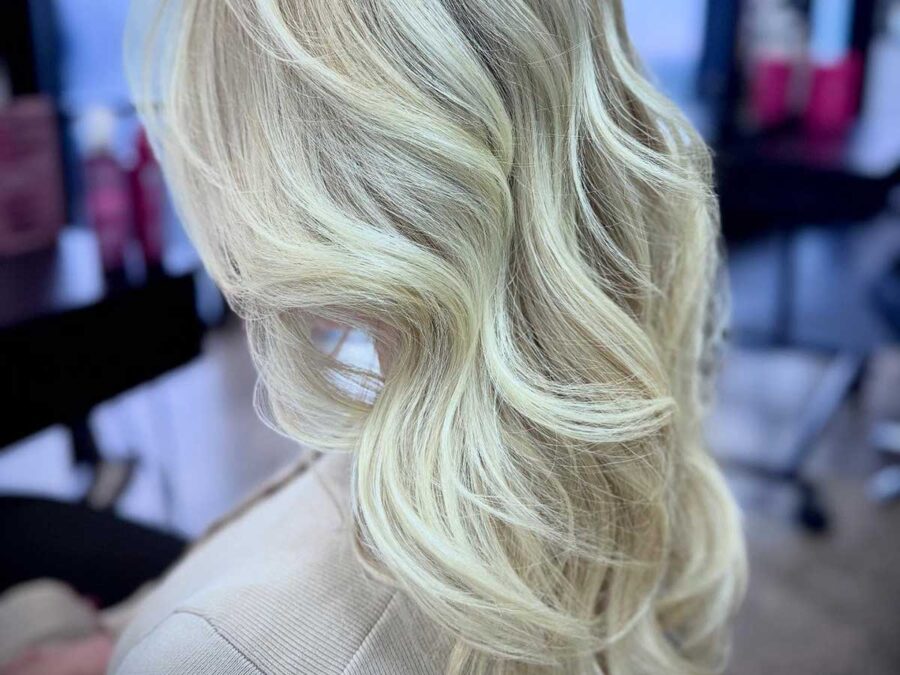 Blonde woman's hair styled by Vivo Halswell hair salon