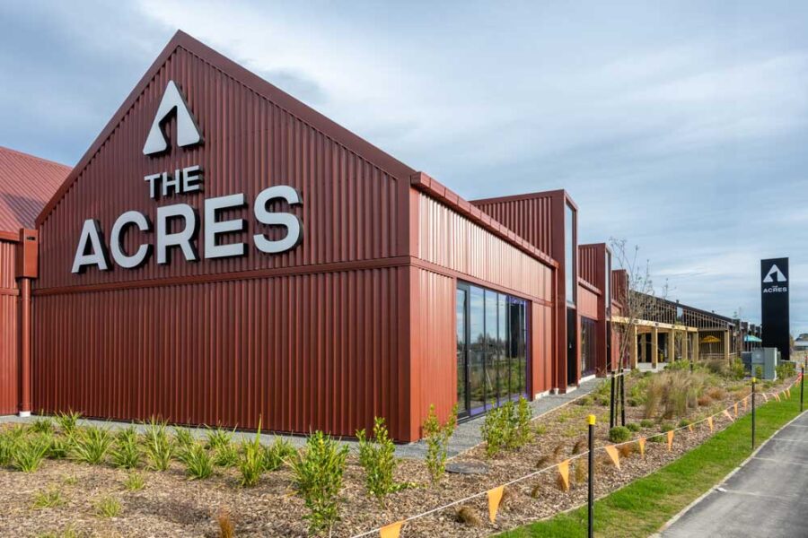 The Acres shopping centre red iron exterior and garden